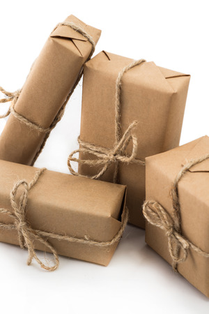 Stack of handcraft gift boxes on white background.の写真素材