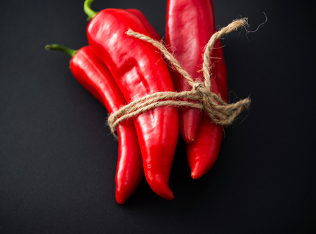 Red Chili peppers on a black background.の写真素材