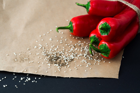 Red Chili peppers on a black background.の写真素材