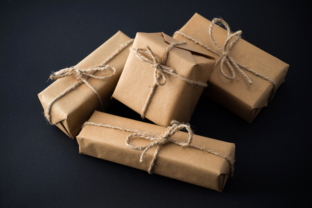 Stack of handcraft gift boxes on black backgroundの写真素材