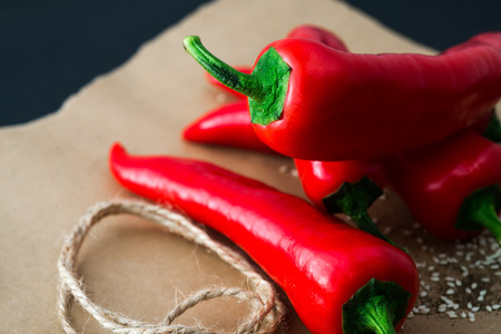 Hot chilli peppers on a paperの写真素材