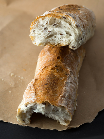 French baguette on paper from aboveの写真素材