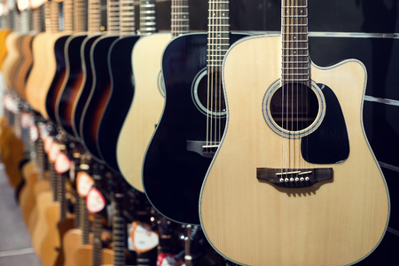 Guitars a row in the store background.の写真素材