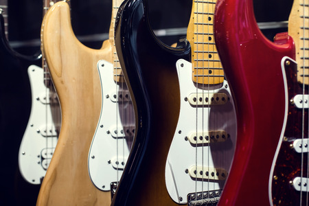 Guitars a row in the store background.の写真素材