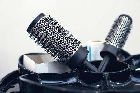 Professional hairdresser tools on the black table.の写真素材