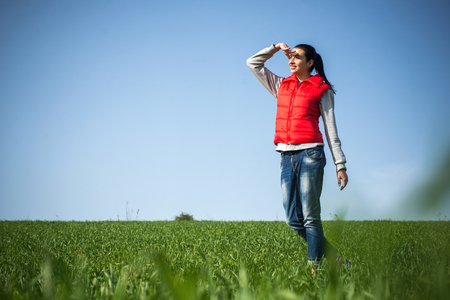 woman relaxing on green grassの写真素材