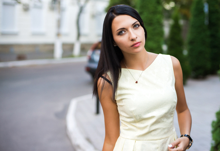 portrain of the beautiful young woman with yellow dress.の写真素材