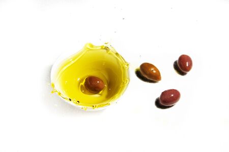 splash made by olive in olive oilの写真素材
