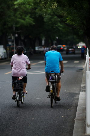 Riding a bicycle on the street peopleのeditorial素材