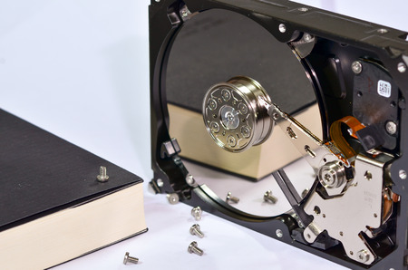 A dismantled mechanical hard diskのeditorial素材