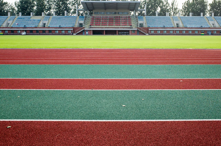 Colorful plastic sports ground.green ground and red runway.のeditorial素材