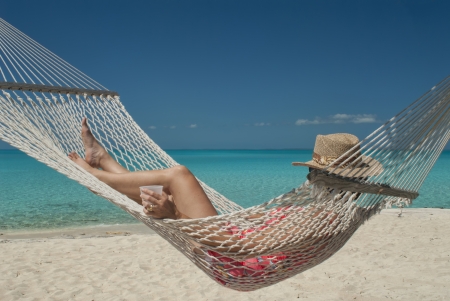woman in hammock at Hawks Nest resort in Cat Island Bahamas の写真素材