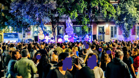 Crowds of people attending a concert in the streets of Barcelonaの写真素材