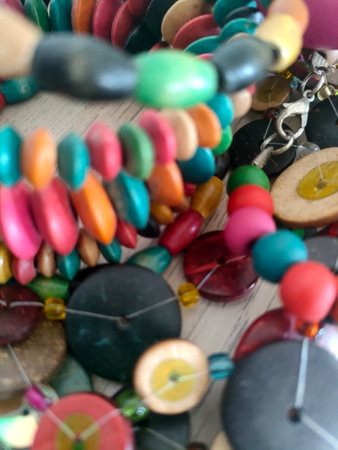 Colorful beads on a wooden background. Beads and braceletsの写真素材
