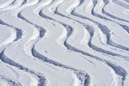 Ski tracks in snowの写真素材