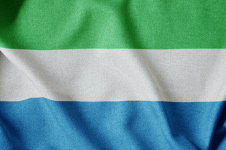 Sierra Leone flag on the fabric texture can be used as background
