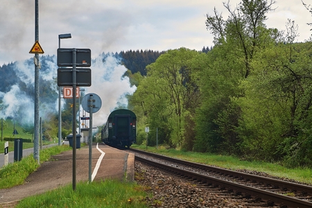 Vintage black steam locomotive train rush railway.の写真素材