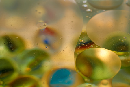 floating in the water abstract colorful, yellow oil drops