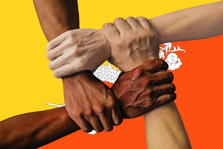 Flag of Bhutan, intergration of a multicultural group of young people.の写真素材