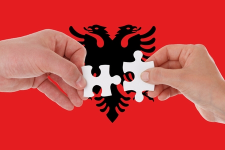 Albania flag, intergration of a multicultural group of young people.の写真素材