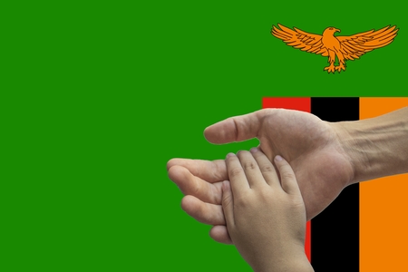 zambia flag, intergration of a multicultural group of young people.の写真素材