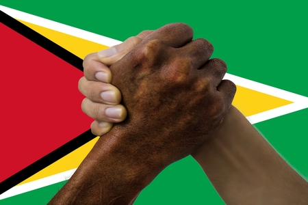 Flag of Guyana, intergration of a multicultural group of young people.