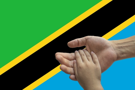 Tanzania flag, intergration of a multicultural group of young people.の写真素材