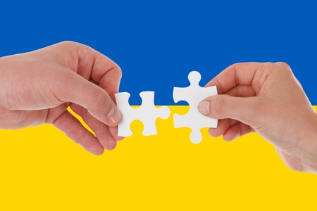 ukraine flag, intergration of a multicultural group of young people.の写真素材