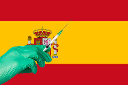 corona vaccination in front of a Spain flag.の写真素材