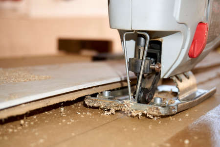 a wooden board, cut with an electronic jigsaw
