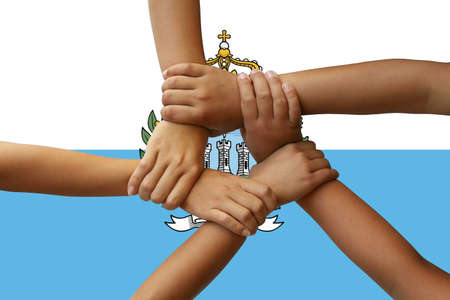 San Marino flag, integration of a multicultural group of young people.
