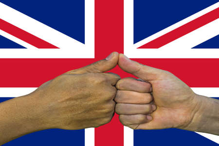 united kingdom flag, integration of a multicultural group of young people.の写真素材