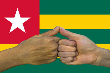 togo flag, integration of a multicultural group of young people.の写真素材