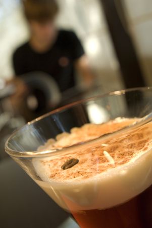 Glass of coffee and man on the background