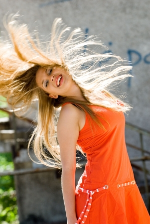 Pretty young lady with flying hairの写真素材