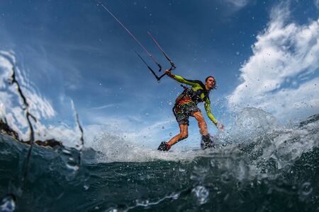Kite surfer on the waves