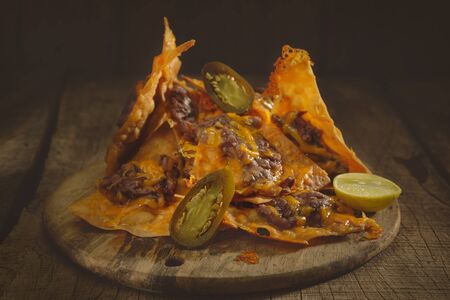 Corn chips served over  wooden table.の写真素材