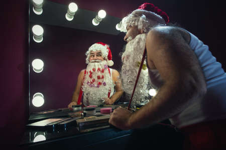 Santa Claus next to the mirrorの写真素材