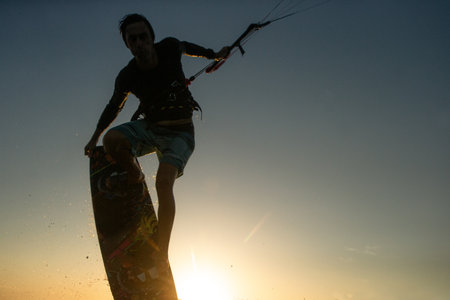A kite surfer rides the waves