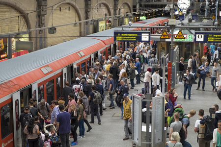Passengers board a train at Hamburg's Main Railway Station (Hauptbahnhof), Hamburg, Germanyのeditorial素材