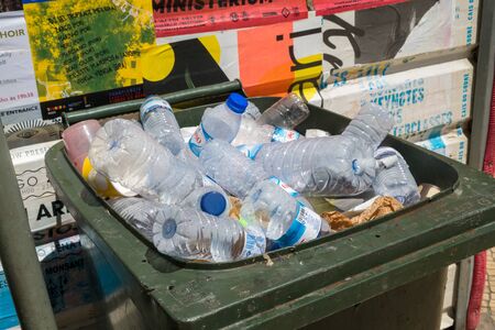 LISBON, PORTUGAL, - JUNE, 3, 2019:  Plastic bottles in a wheelie bin.のeditorial素材