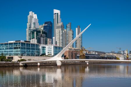 BUENOS ARIES, ARGENTINA, - APRIL, 20, 2019: The Waterfront (Puerto Madero) with the Puente de la Mujer suspension bridge in Buenos Aires, Argentina, South America.のeditorial素材