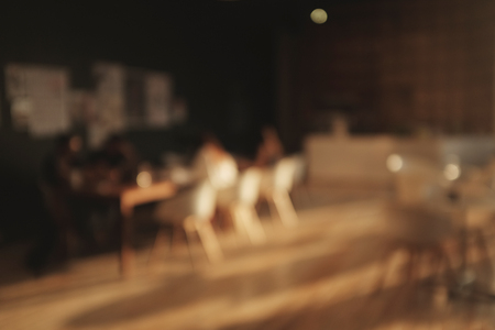 Blurred background image of coffee shopblur group of people working at co-working space, casual style, , business, education concept.Blur library backgroundの写真素材