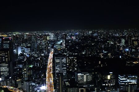 Building at night..Abstract Night City. Modern Cityscape with Skyscrapers.の写真素材