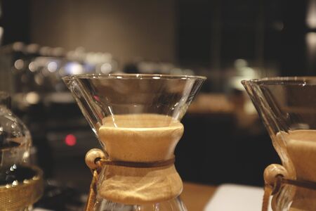 Coffee drip set on wooden table. Close up