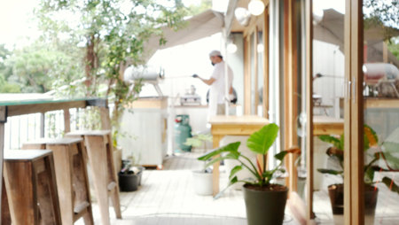 Blur background of a terrace withsmall kitchen in garden.