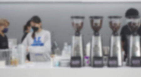 Blur coffee shop or cafe restaurant with abstract bokeh light image background. People in store Blur Background or design key visual layoutの写真素材