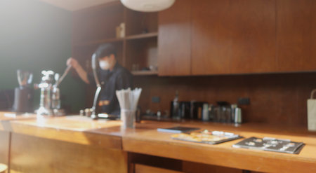 Blur image of coffee shop with bokeh for background usage.