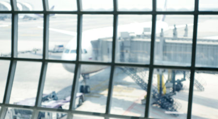 Blurred background of an airplane in the airport. Intentionally blurred post production for bokeh...