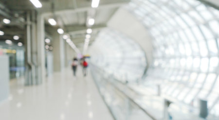 Blurred image of people walking in the lobby of the airport.の写真素材
